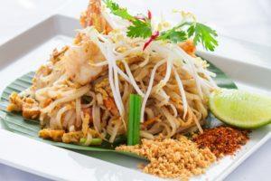 Delicious pad Thai garnished with shrimp, bean sprouts, and lime