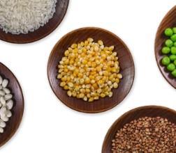 A variety of grains and legumes in wooden bowls