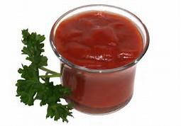Tomato sauce in a clear glass cup