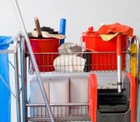 Cleaning cart filled with cleaning supplies